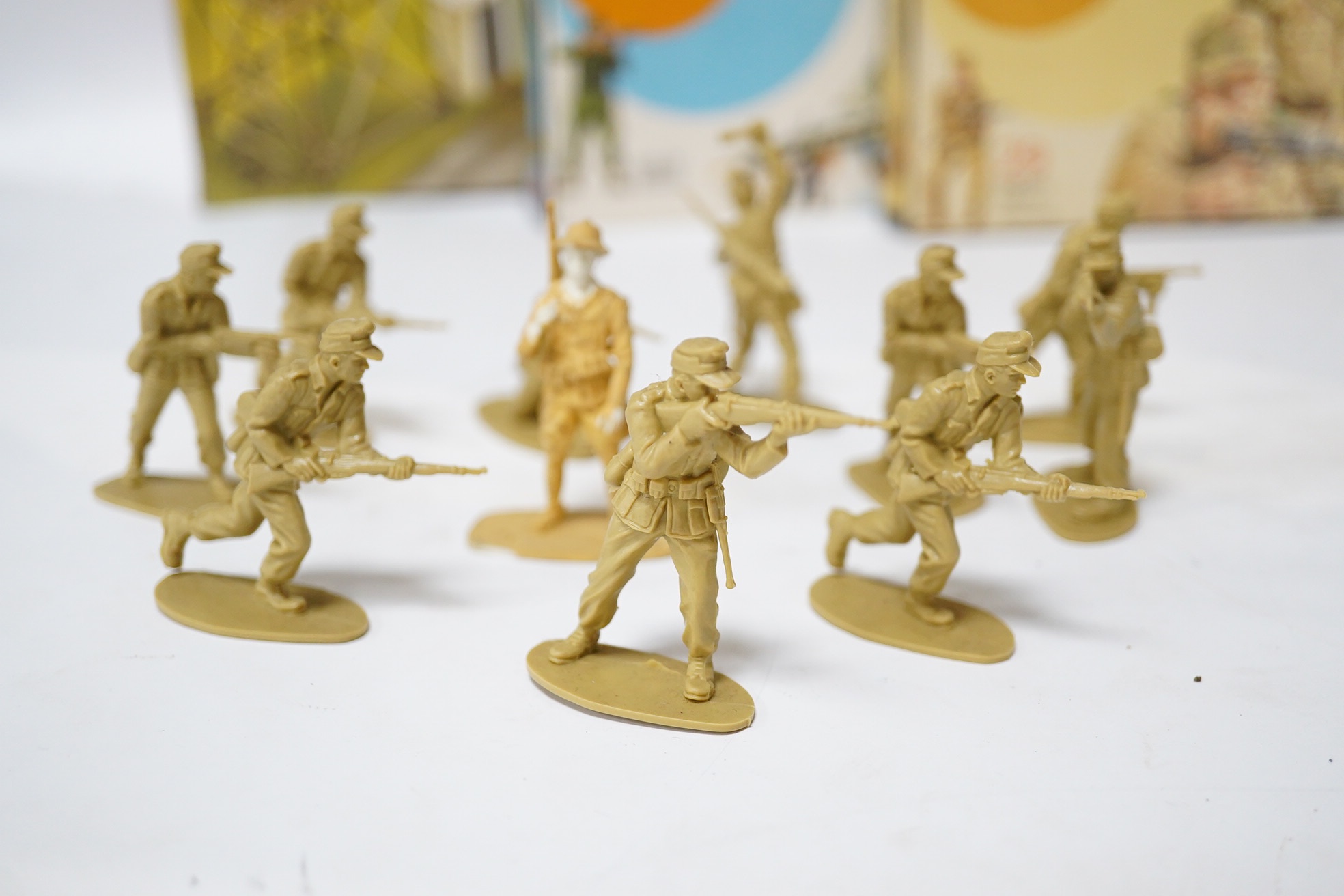 A collection of 1970s boxed Airfix 1:32 scale plastic WWII soldiers, Mainly British and German troops, Together with two Airfix clip-together Combat Packs, Battle Action scenes, and a Military Series Checkpoint, plus a L